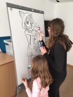 Zwei zeichnende Kinder am flipchart ©ToonSchool